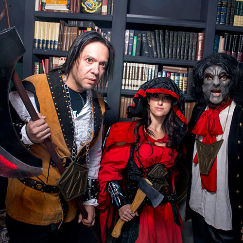 medieval man with large axe, red riding hood with small axe and werewolf