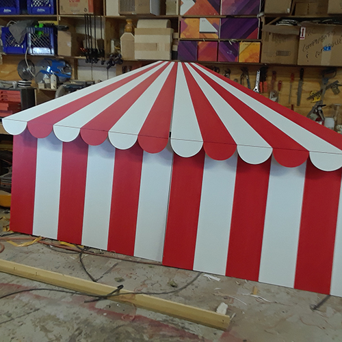 2-d circus prop with red and white stripes